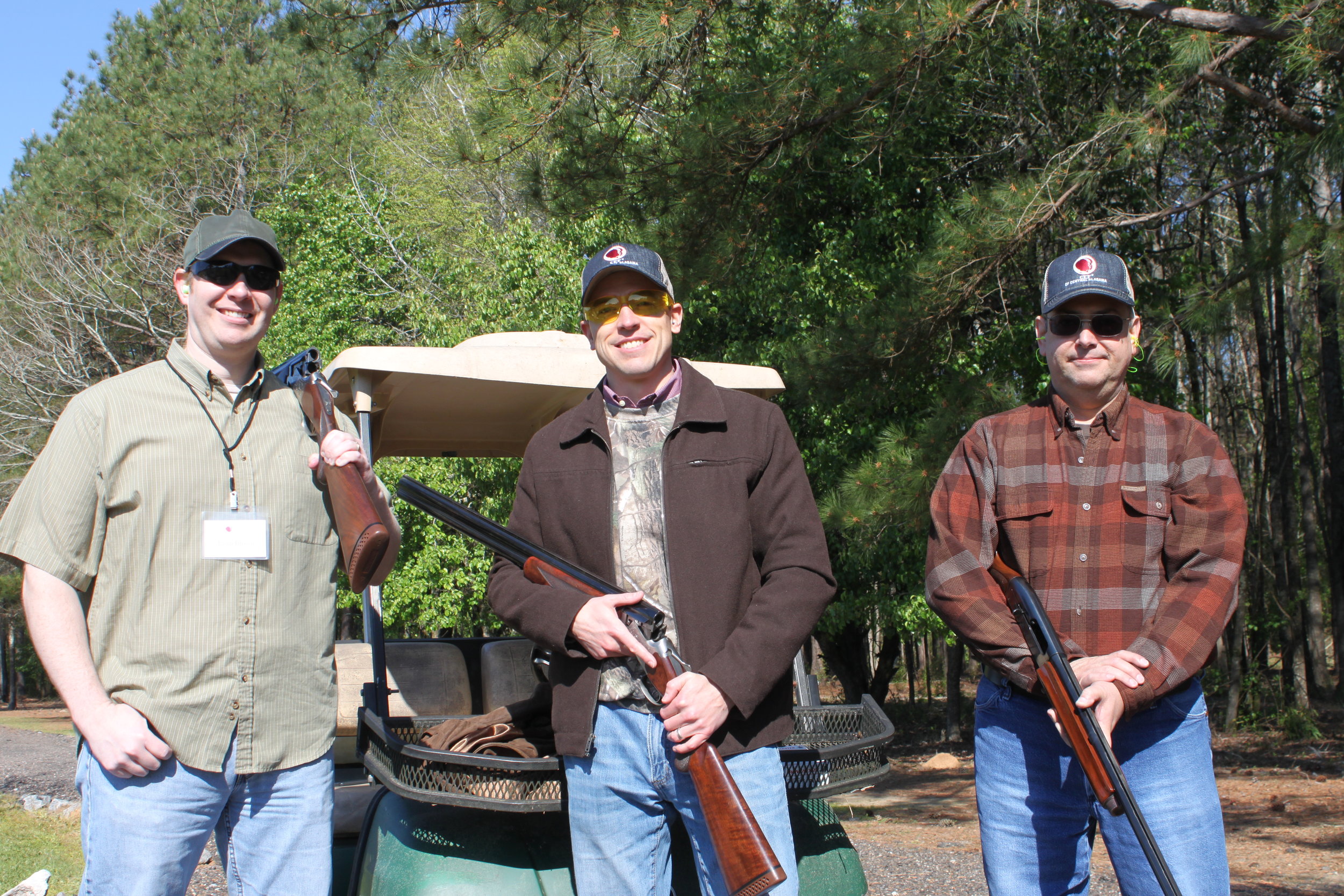  Evan Brown (left) participates with his team at the Good News Clay Shoot to benefit  CEF®  of Central Alabama Summer Missions.  