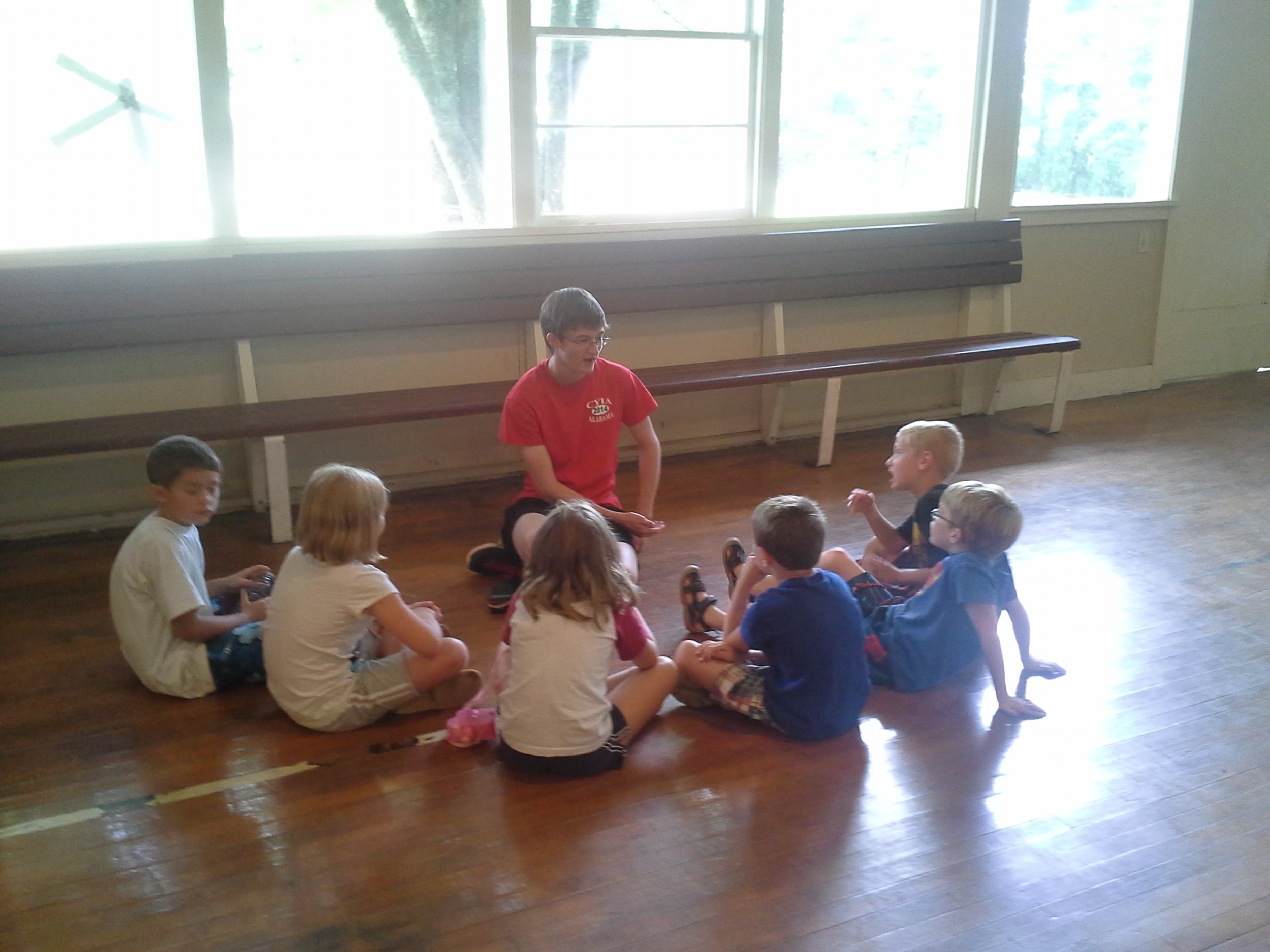  Andy Russell counsels children after a Bible lesson at a Camp Grandview  5-Day Club®  in Wetumpka, Alabama.    