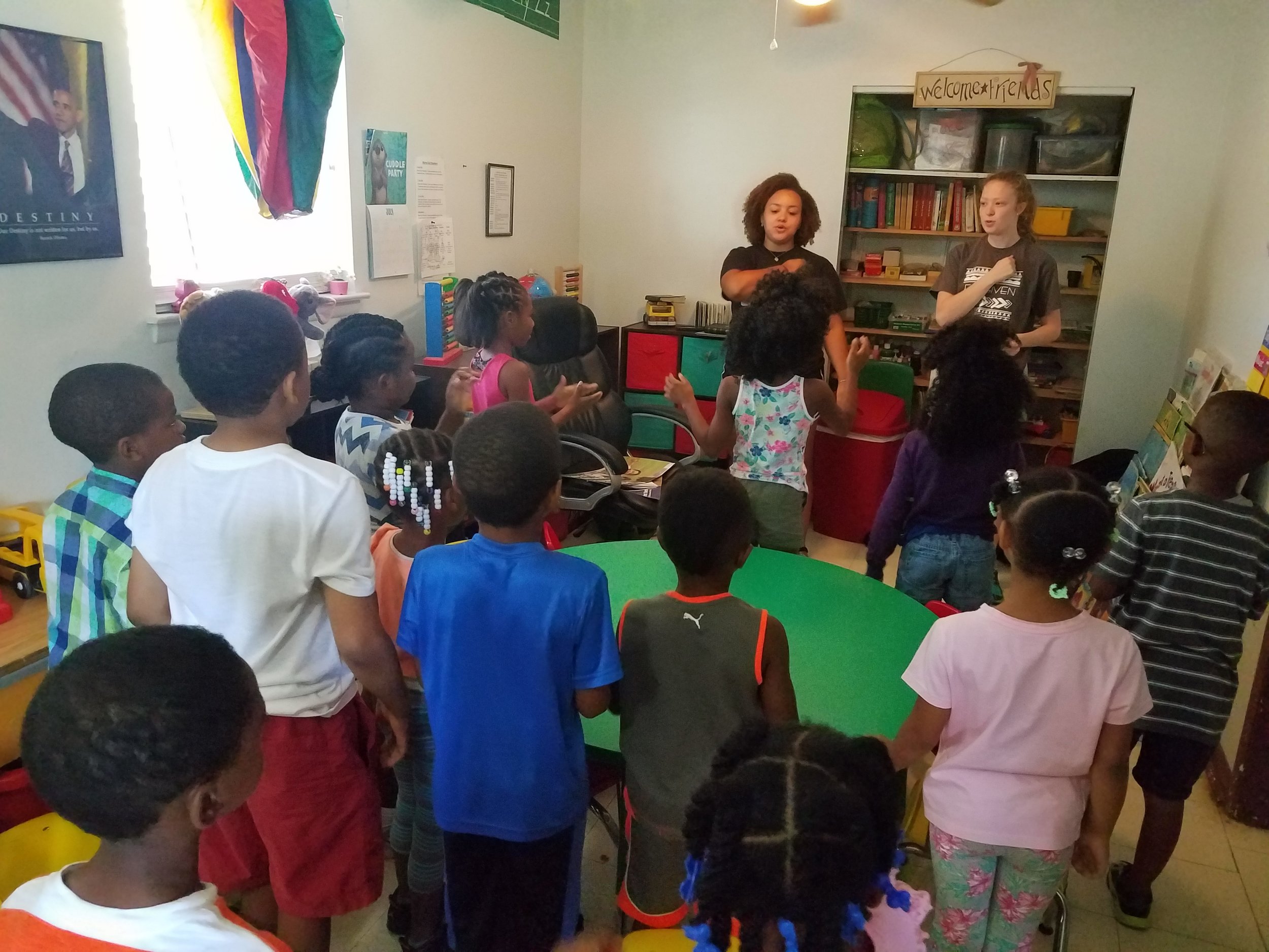  Jade Marcum and Liz Claxton lead music during  5-Day Club®  at Jaad’s Daycare in Montgomery, Alabama .  