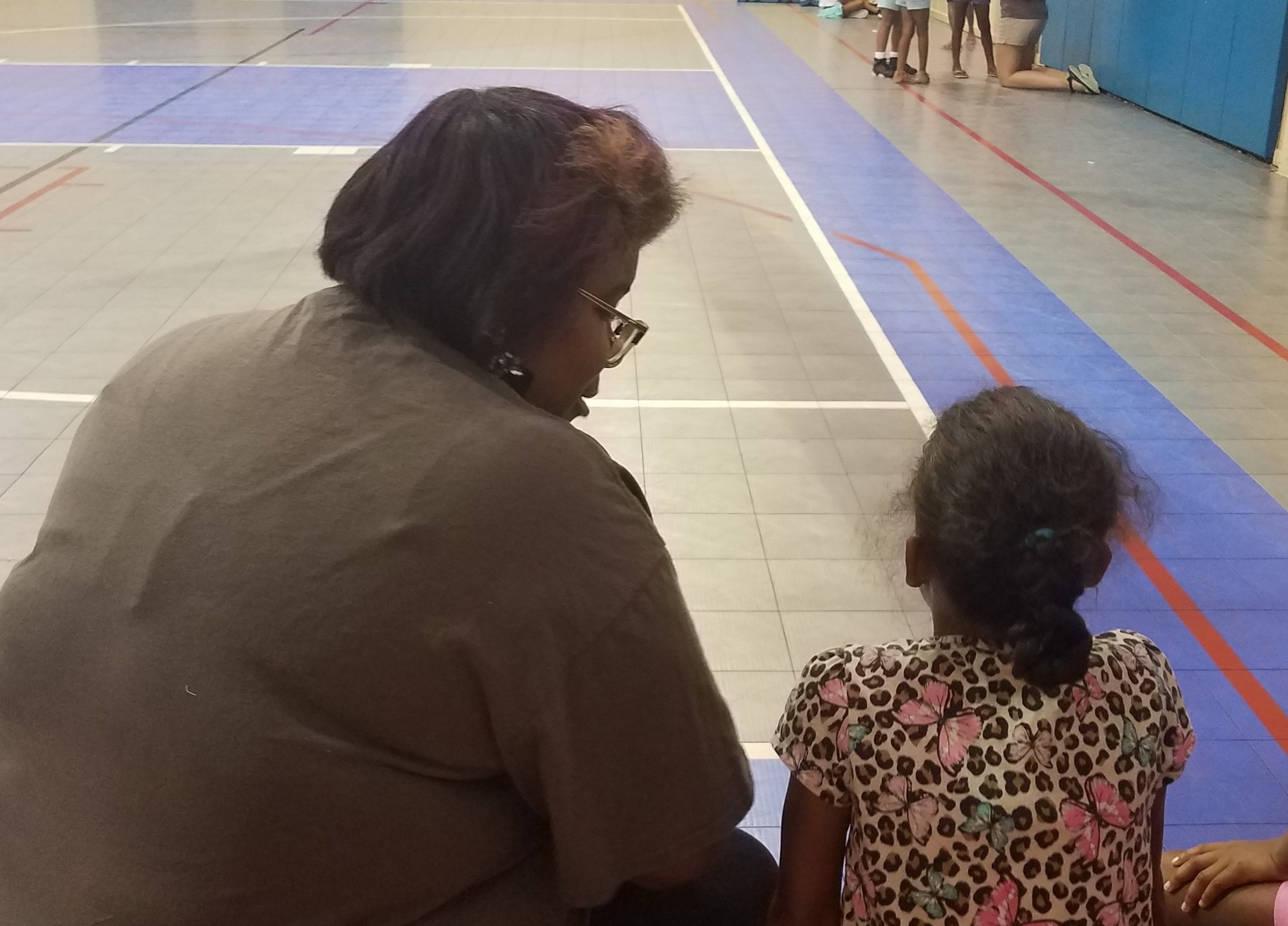  Ruth Barnes counsels a girl after a Bible lesson at a  5-Day Club®  at the Bell Road Goodtimes Center in Montgomery, Alabama.  