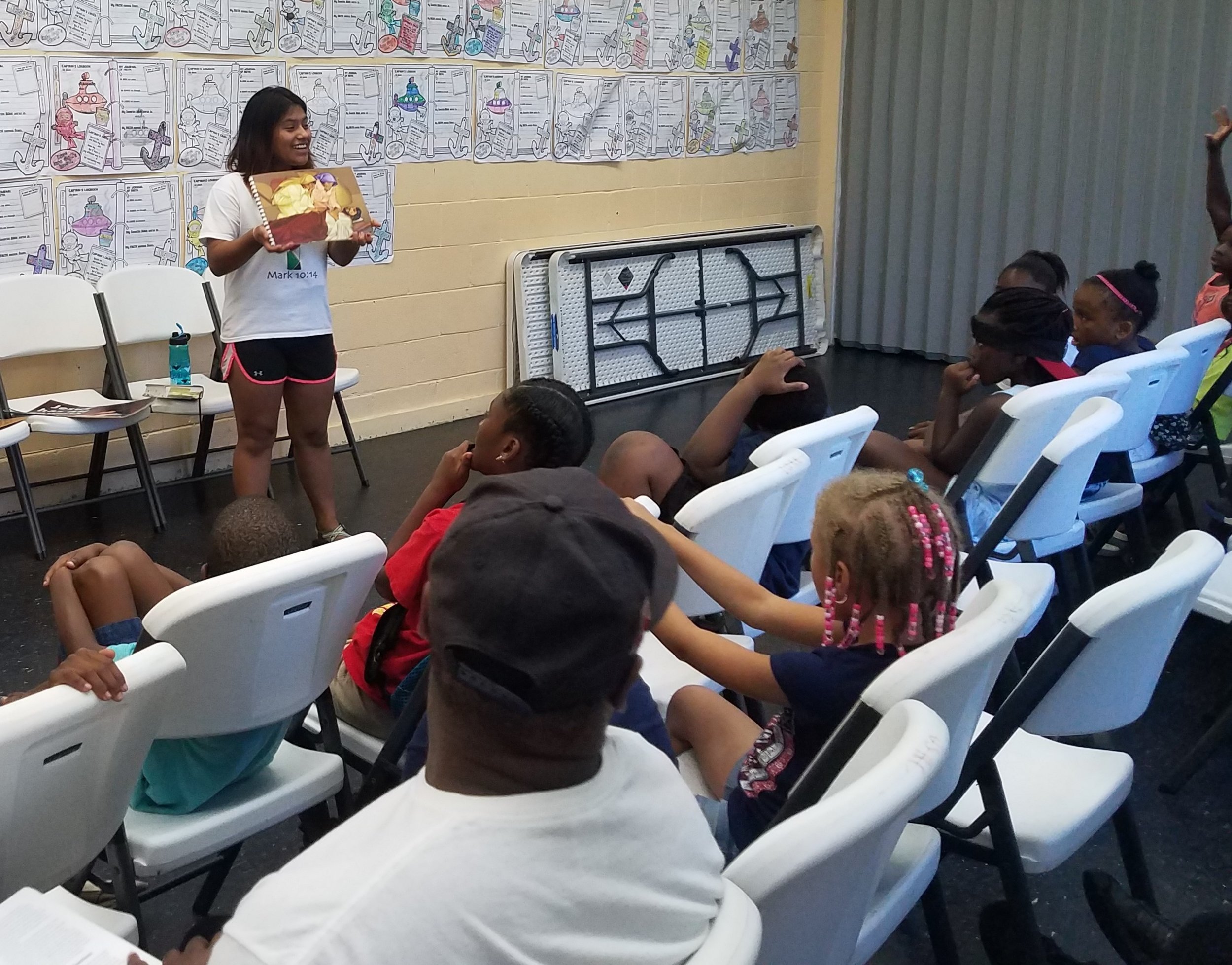  Marisol Luna teaches the Bible lesson of Jesus healing the official’s son in  5-Day Club®  at the Union Spring Community Center.  