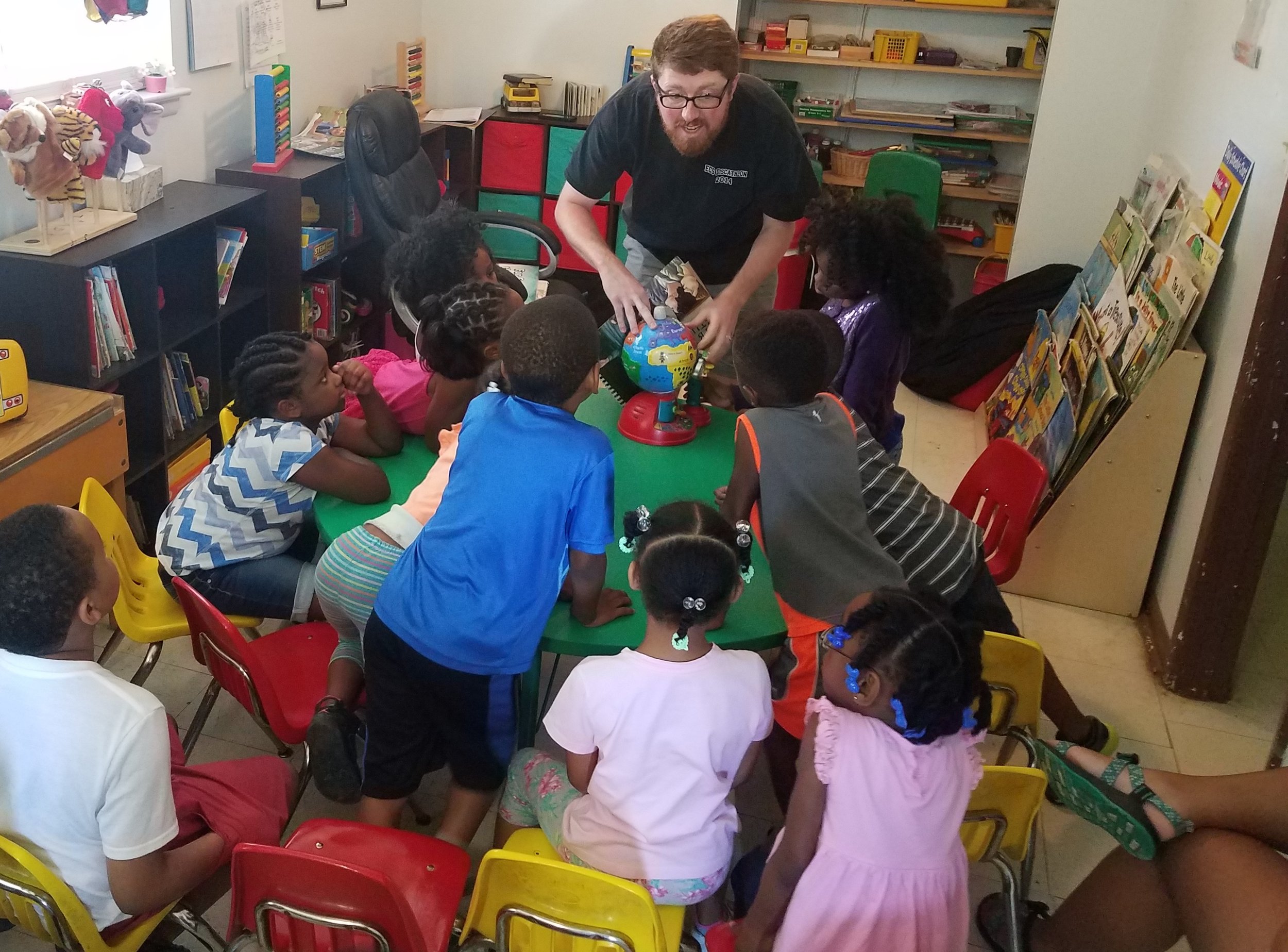 Adam Coppock of Young Meadows Presbyterian church teaches about missions at a 5-Day Club® at Jaad’s Daycare in partnership with CEF® of Central Alabama. .
