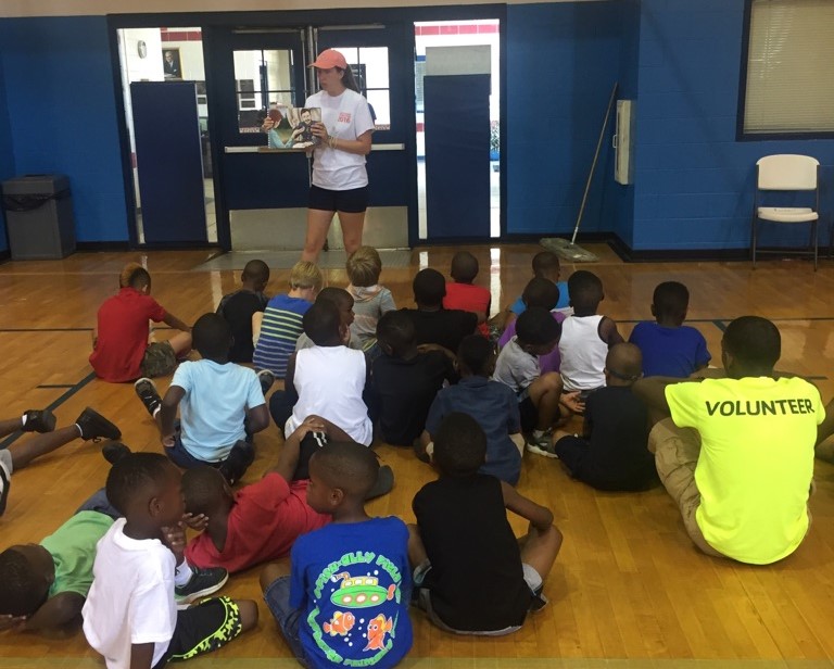  Emily Burkhalter, intern from Young Meadows Presbyterian Church, teaches the story of Mary Slessor, missionary to what is now Nigeria, to children in  5-Day Club®  at the Kershaw YMCA in Montgomery Alabama.    
