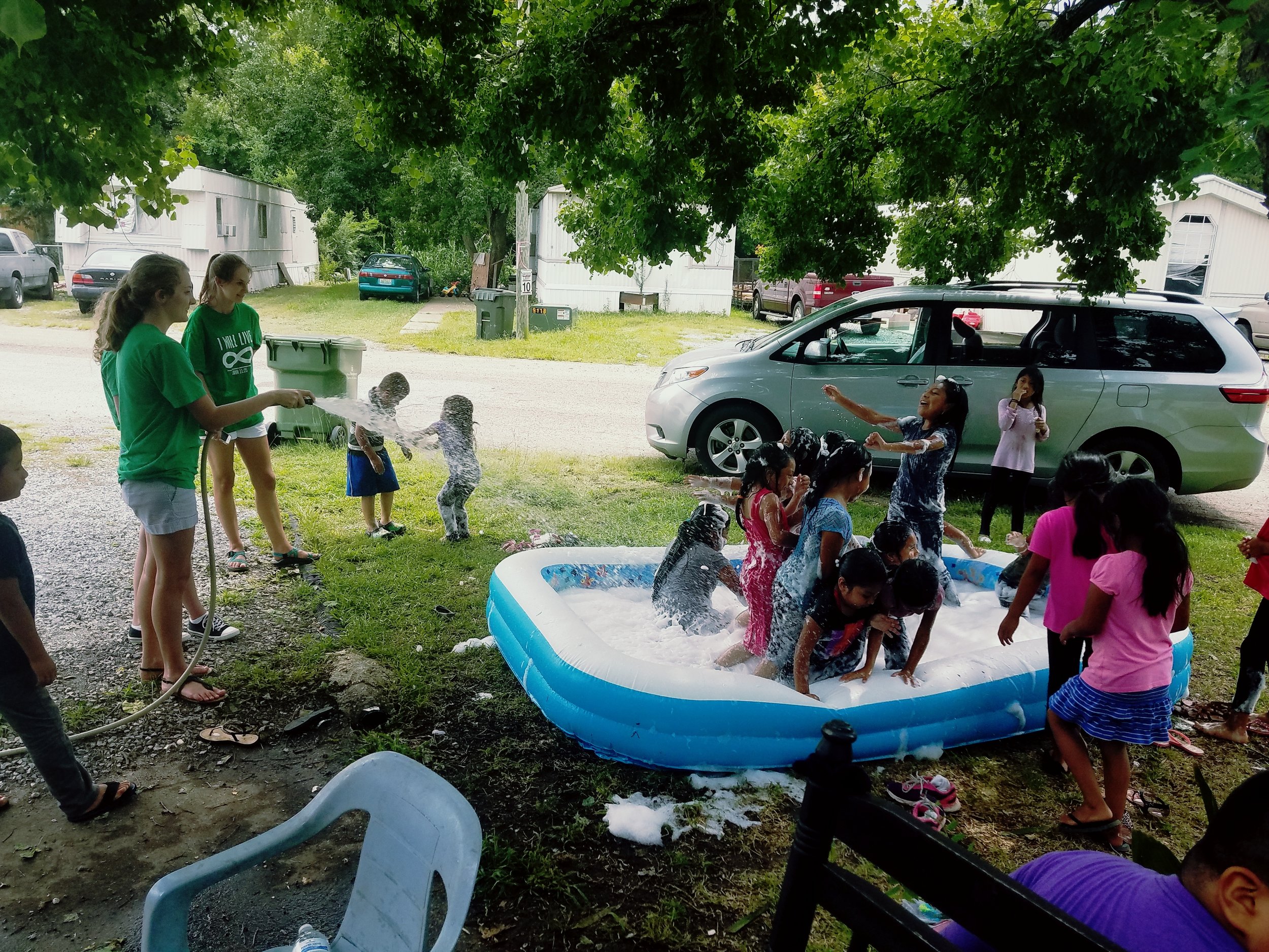 Casey Falcione, of Gateway Baptist Church, and Francie Parker host a water day during 5-Day Club® at Regency Park in Montgomery, Alabama, as part of partnership between Gateway Baptist and CEF® of Central Alabama.