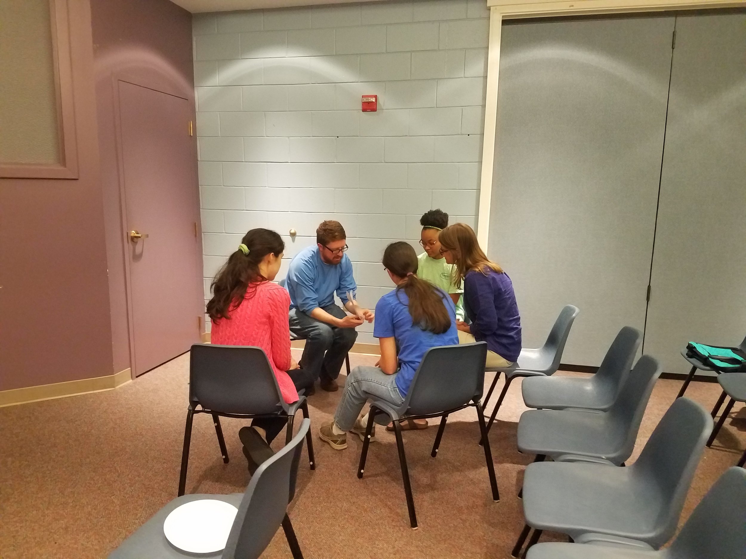 Adam Coppock, of Young Meadows Presbyterian, leads his Summer Mission team in prayer at the Summer Church Training in partnership with CEF® of Central Alabama. .