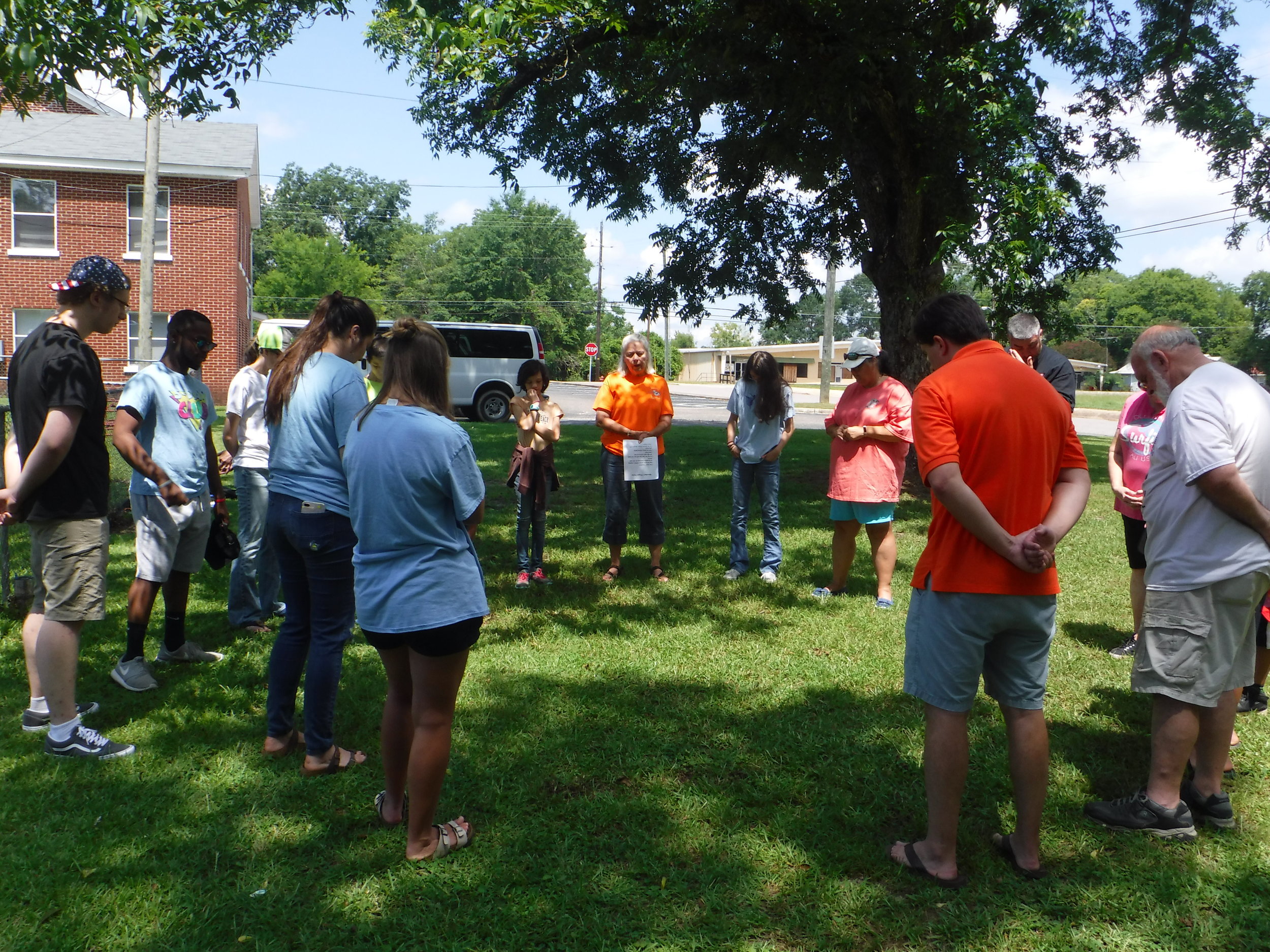   Christian Youth In Action ®  team and First Baptist team pray together before their first day of  5-Day Club®  ministry. 