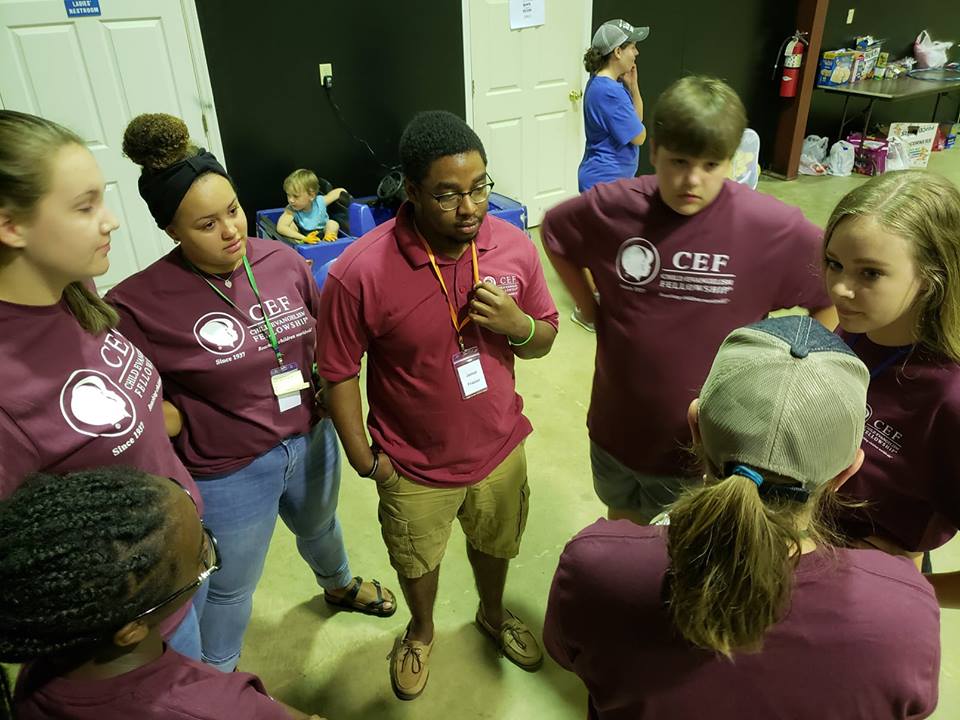  Savannah Barber, Assistant to the Ministry Coordinator, (bottom right corner) helps prep a team for  5-Day Club®  at  CYIA™  training. 