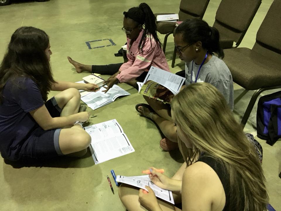  Christian Youth In Action ®  missionaries study for an assignment at training.  