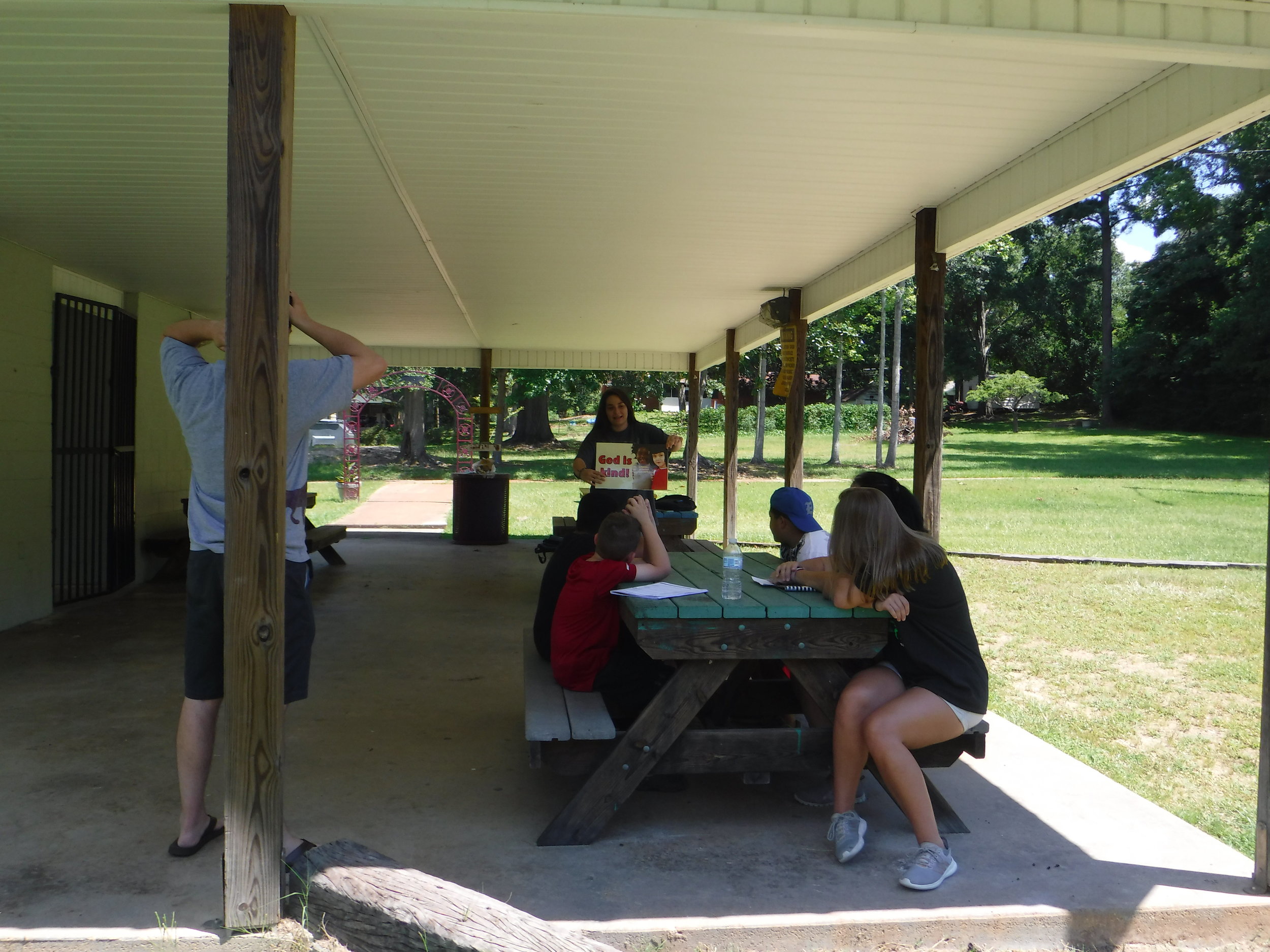  Abby Solomon and Mary Phyfer Parker,&nbsp; Christian Youth In Action®&nbsp; interns, with Jeremy Brown, student minister, and Cheryl Roberson, members of FBC Eclectic, host &nbsp; 5-Day Club®&nbsp;at Panther Palace Park in the center of town.   