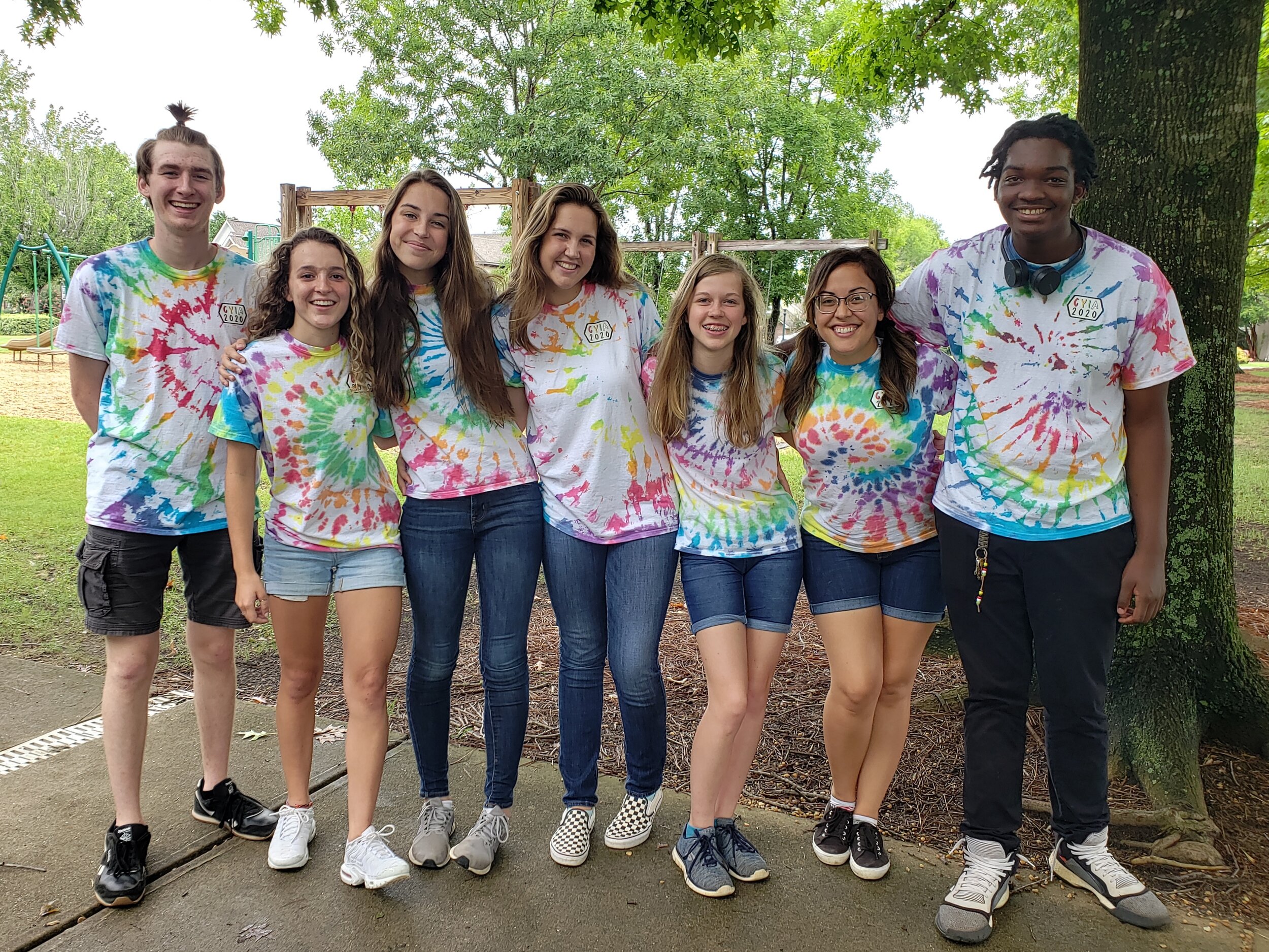  Right to left: Micah Brown, Grace Martin, Chloe Carver, Kate Carver, Grace DuPre, Naomi Kemp, and Silas Jones at an out doors 5-day club in June 2020 after sharing the Gospel with neighborhood children! 