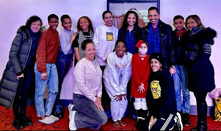 Savi and family with the cast of The Lion King!