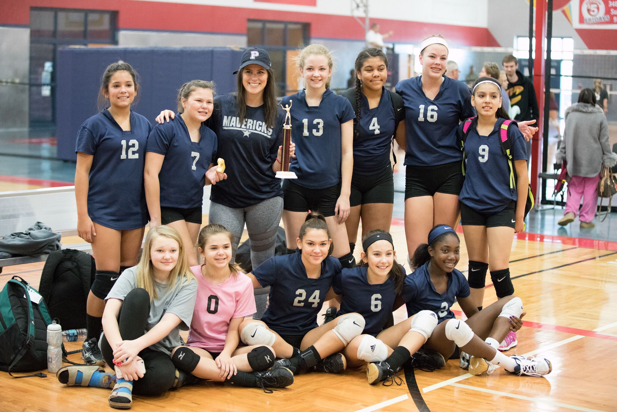 The 7th grade A-team poses with their trophy