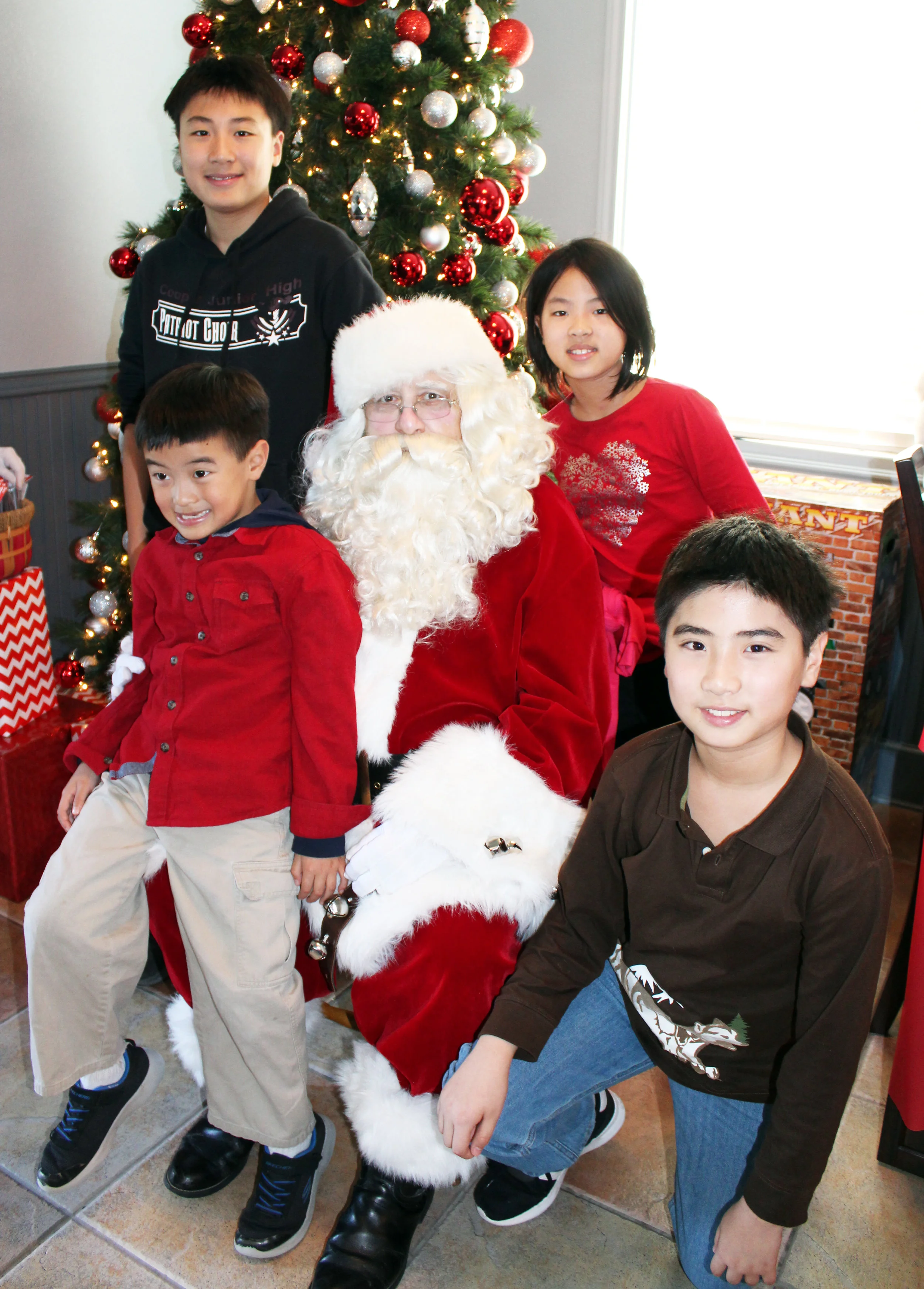 The Wang children (Front row, from left) Cody and Sevy, (back row, from left) Leon and Suri.