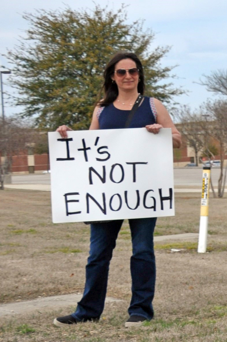 A parent joins an anti-bullying protest at MMS