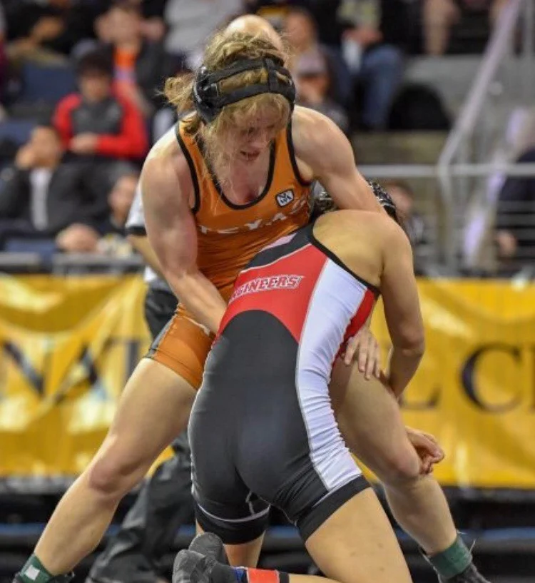 Luci Schement defends her opponent's single leg shot (wrestling move) during the finals match.