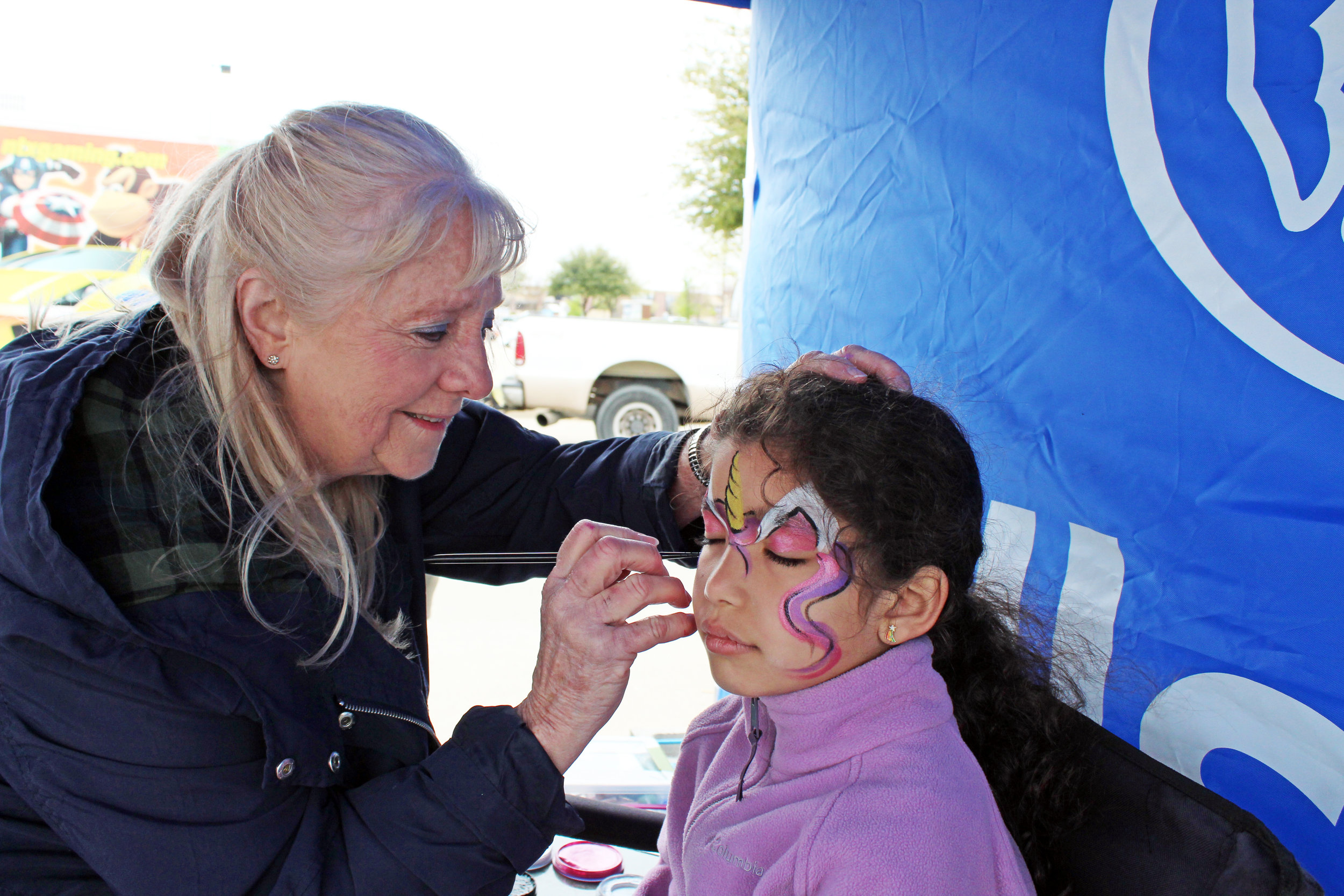 Murphy Allstate agent, Zane Shepherd, provided free face painting at his vendor booth. Minahil Mughal chose to have a colorful unicorn painted on her face.