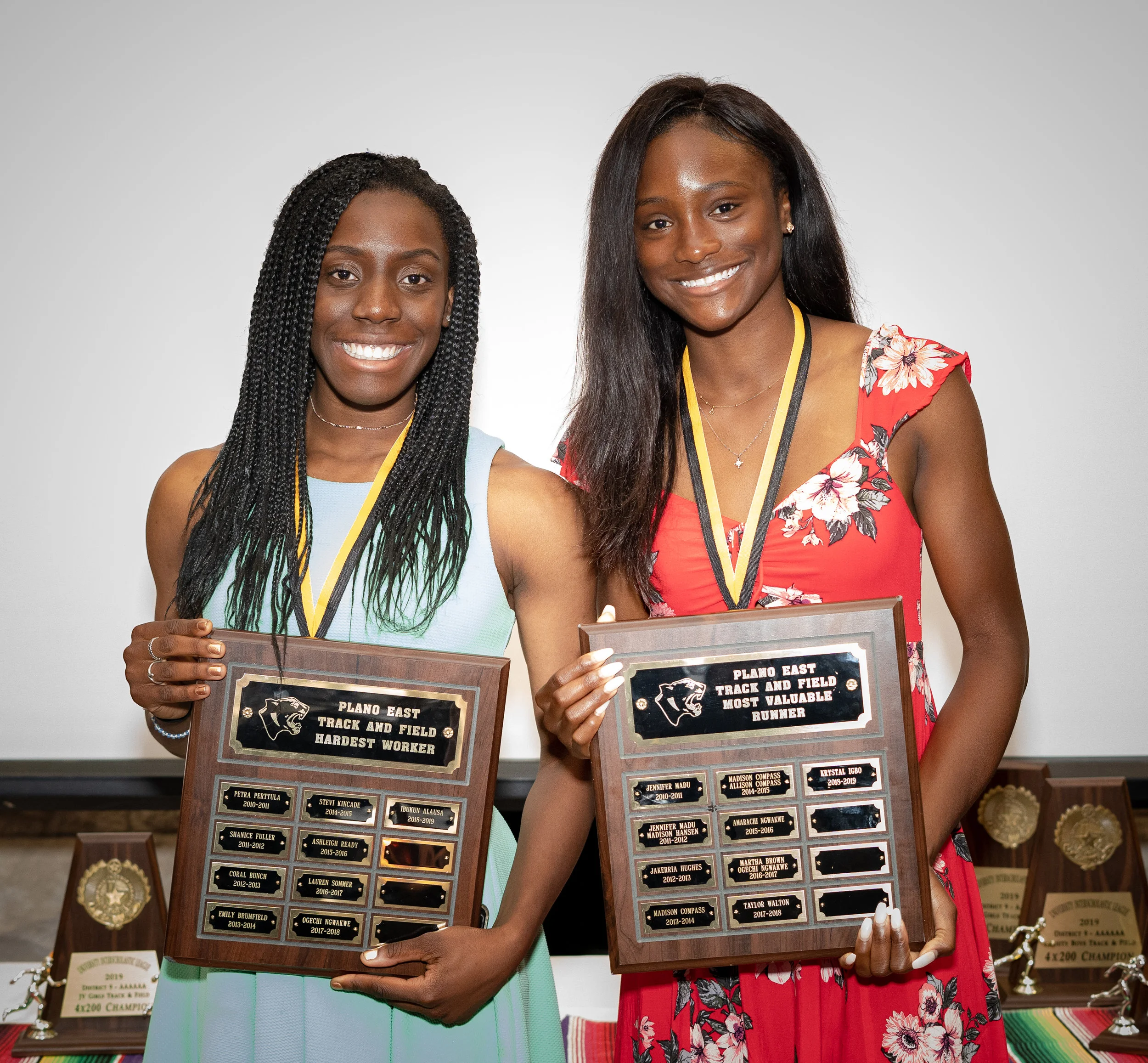 Ibukun Alausa (Hardest Worker) and Krystal Igbo (Most Valuable Runner) are presented with awards.