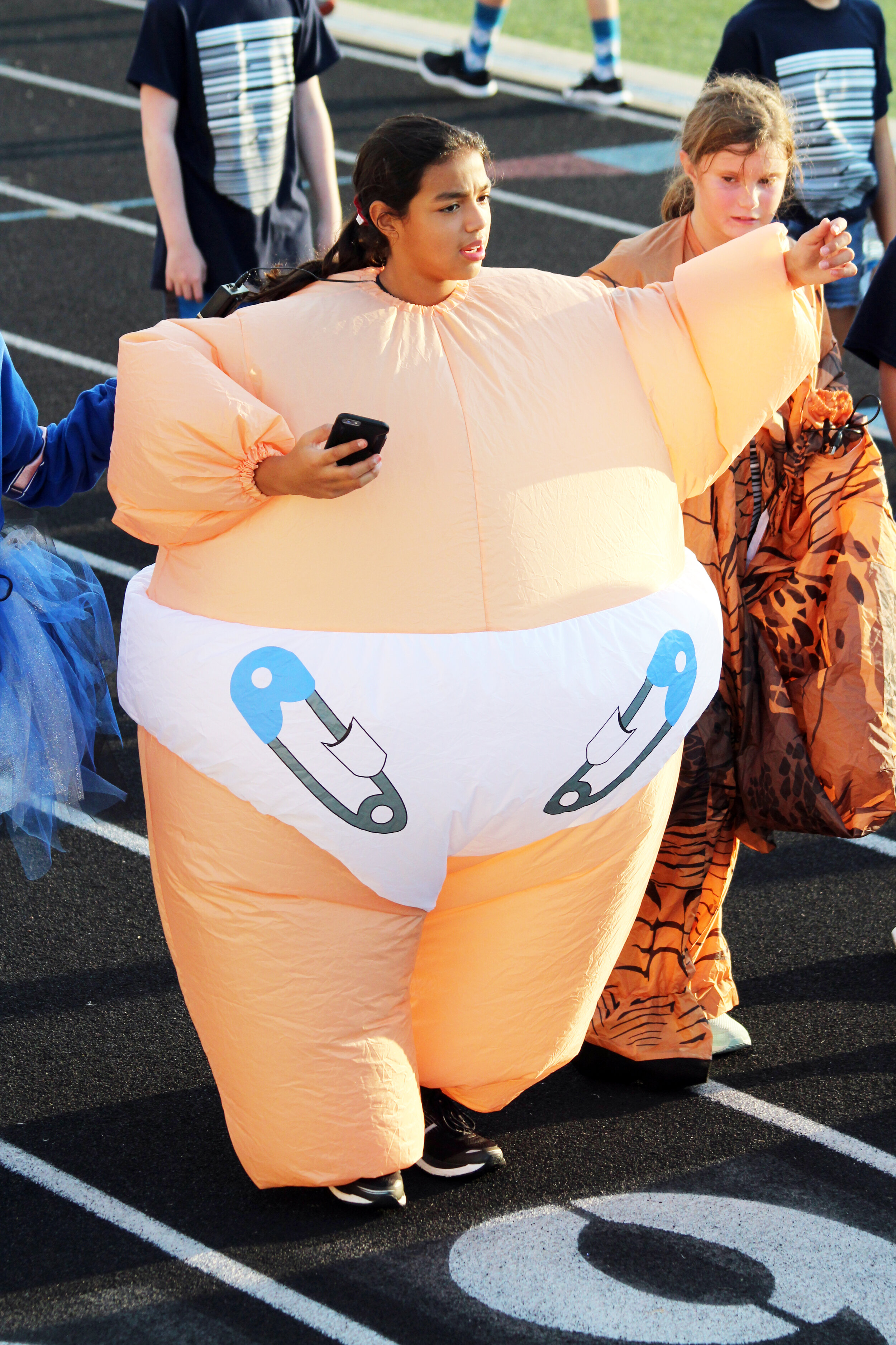 A march-a-thon is never complete until there is an inflatable bouncy baby making the laps on the track.