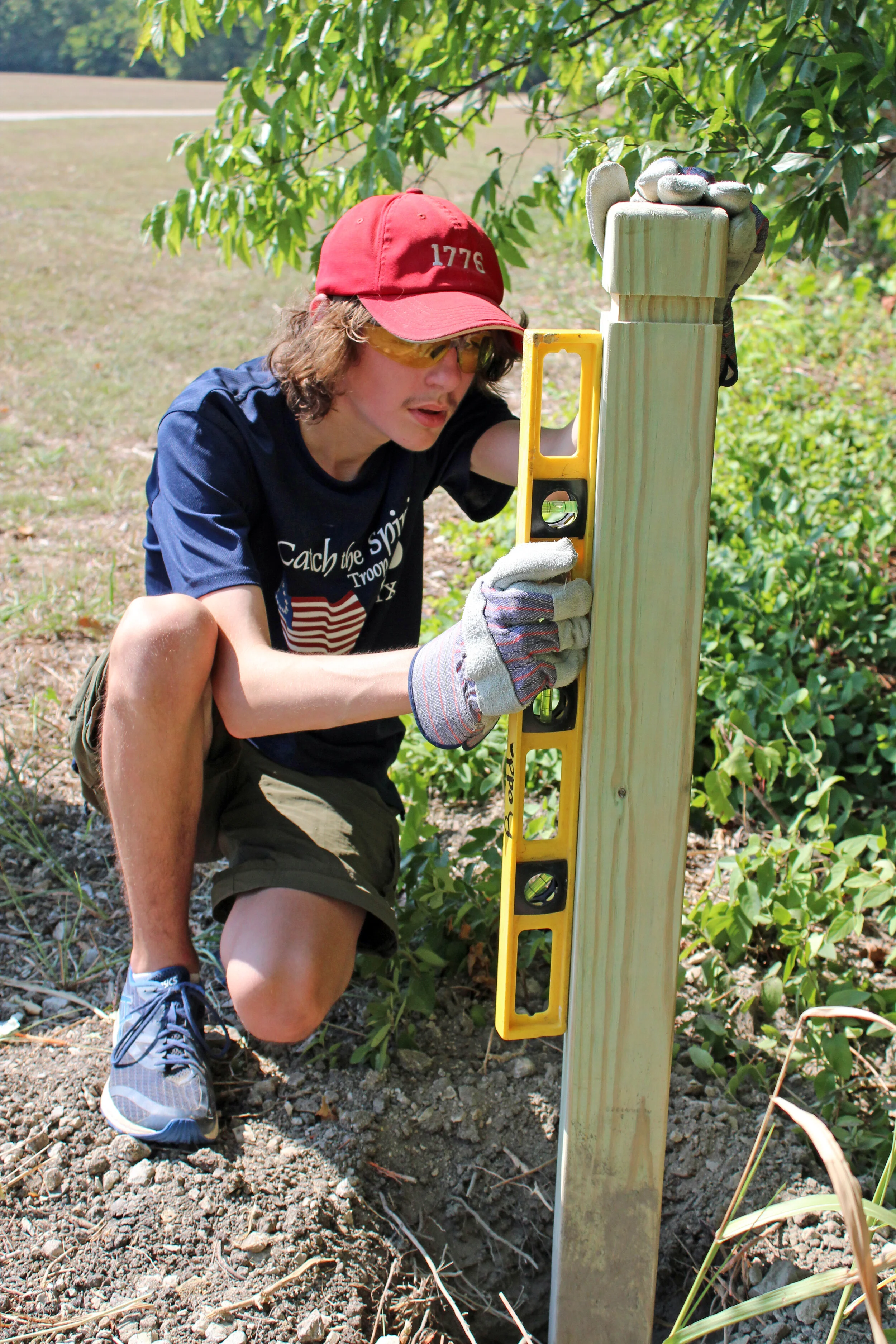 Arik Rodda checking the level of a trail marker located at one of the trailheads.