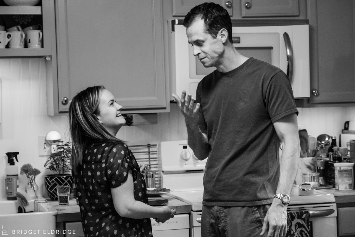 mom and dad smile at each other