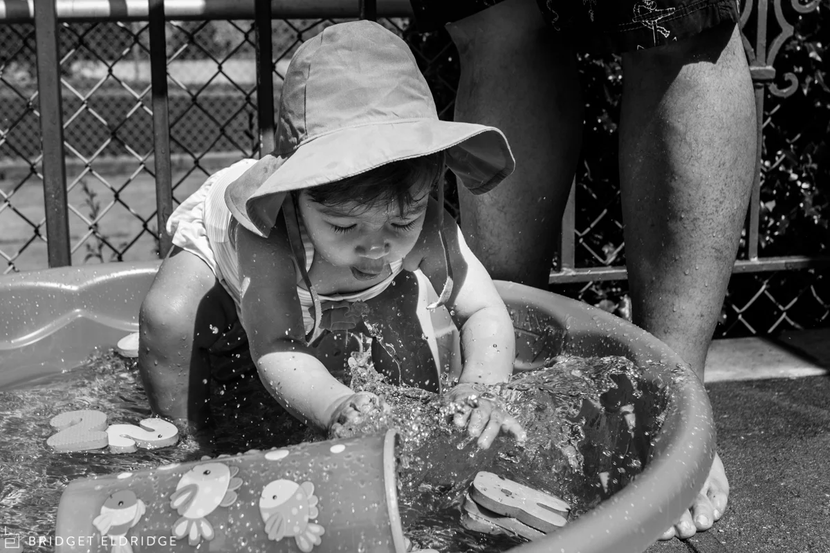 girl plays in the pool