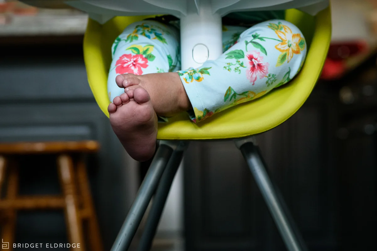 baby toes in a high chair