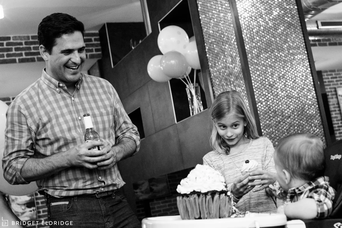 dad laughs at son's reaction to trying cake for the first time