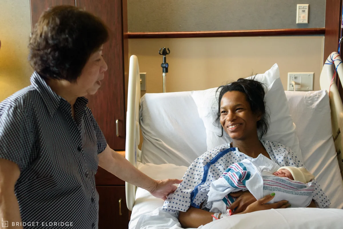 grandmother says goodbye to new mom and her newborn