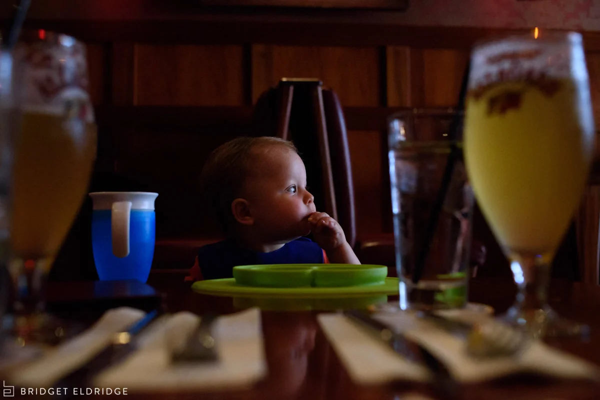 Toddler eats his lunch at Boxcar Tavern across the street from Eastern Market.