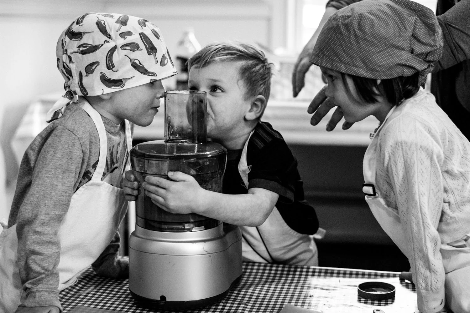 kids have a silly moment in cooking class