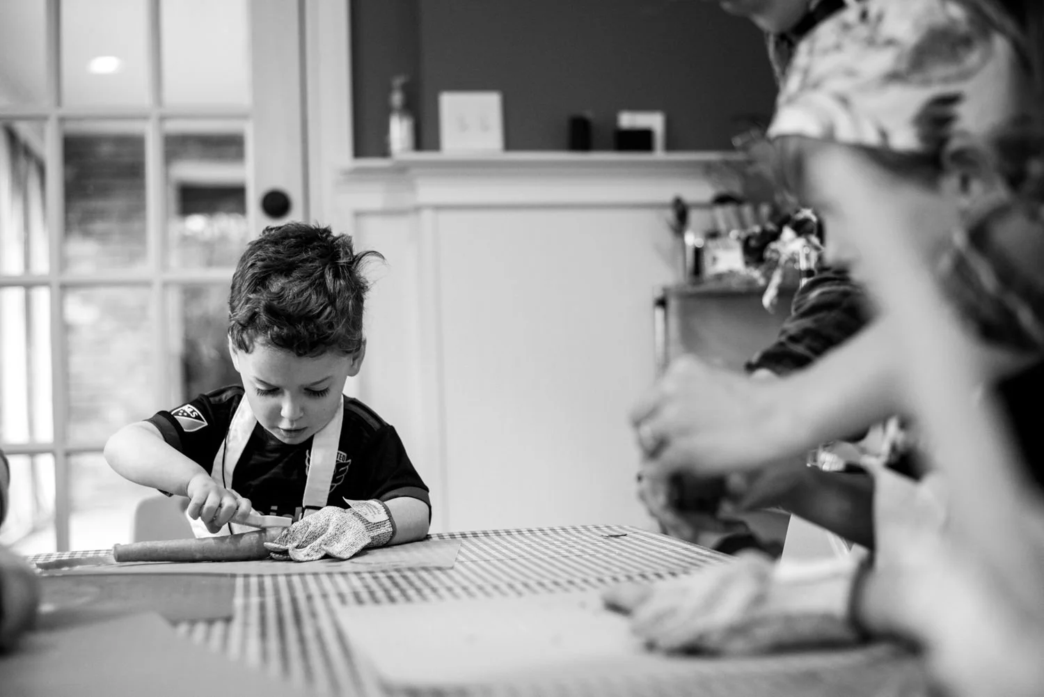 boy works on peeling a carrot