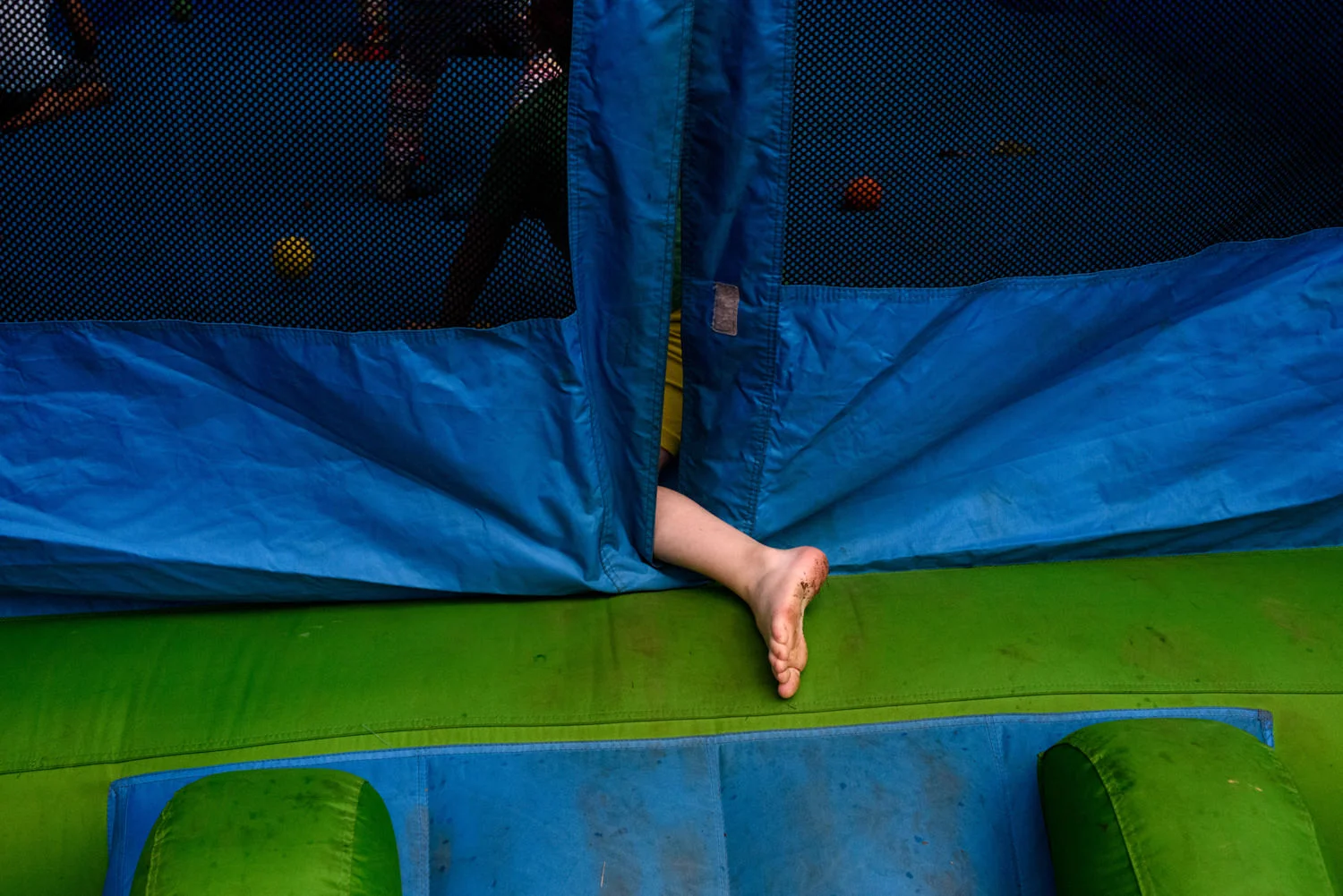 dirty foot as kid gets on the trampoline