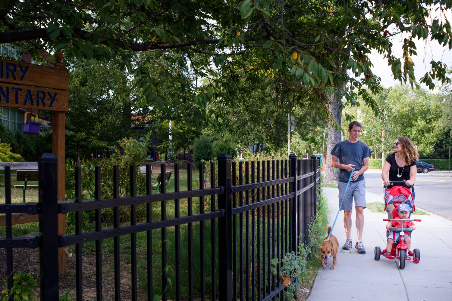 family takes a walk in the capitol hill neighborhood of washington dc