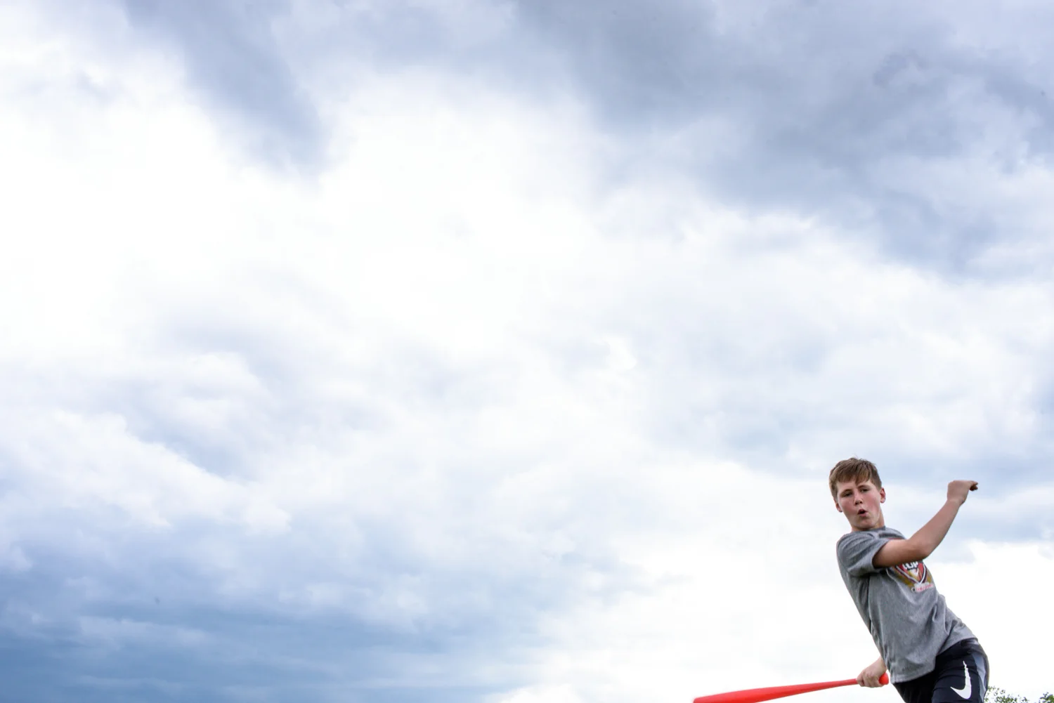boy swings a bat