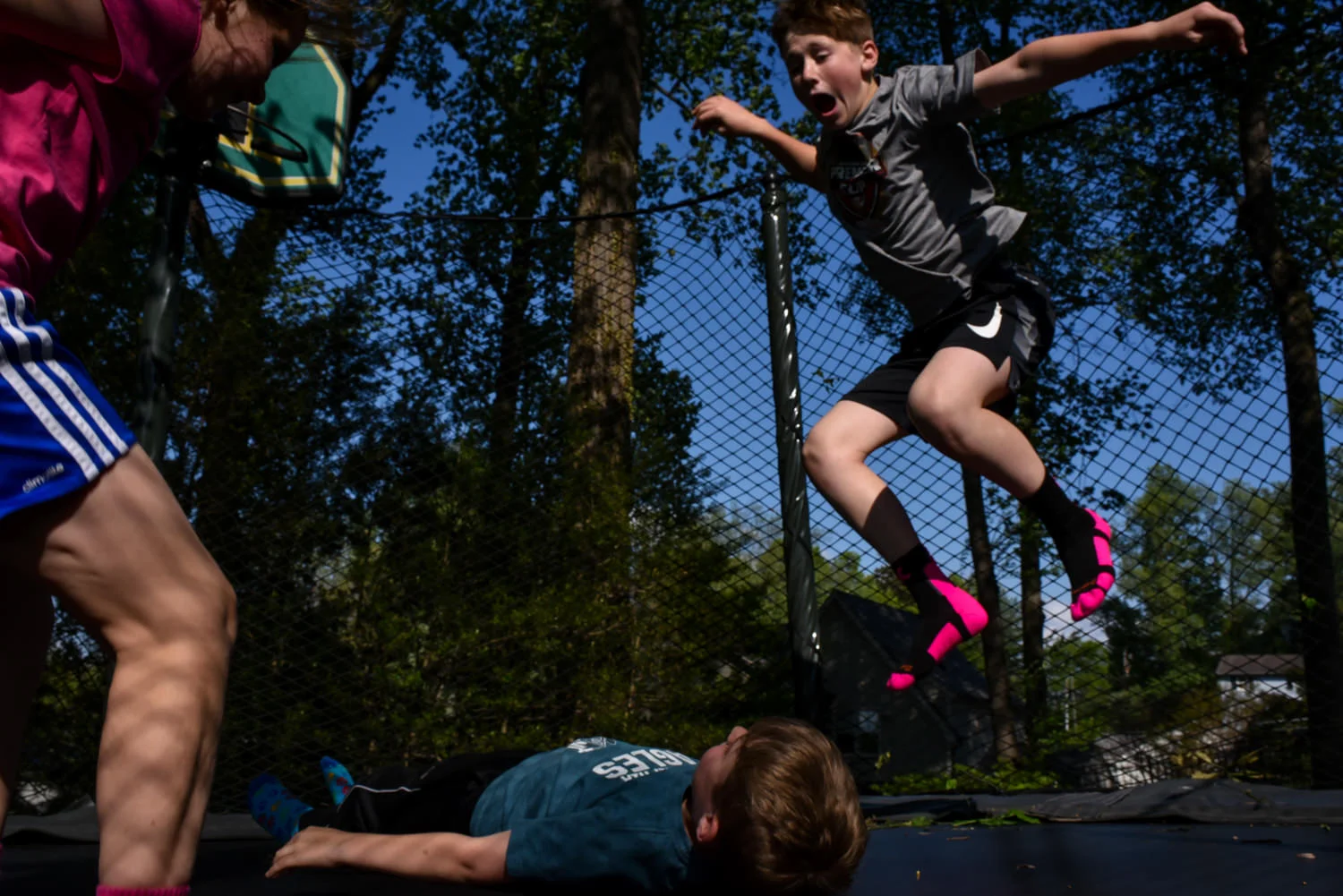 kids jump on a trampoline