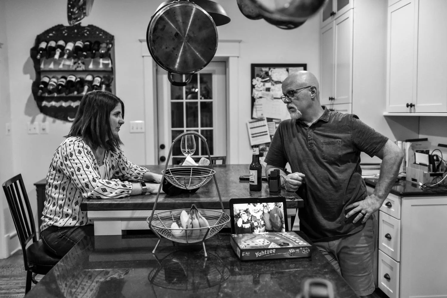 mom and dad talk in the kitchen after dinner