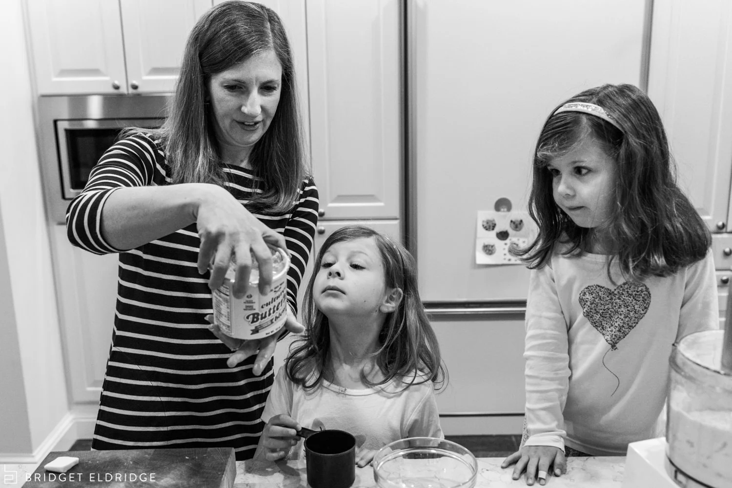 mom and her daughters make scones