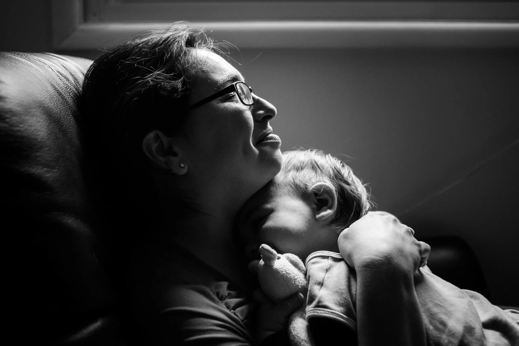 mom rocks baby to sleep