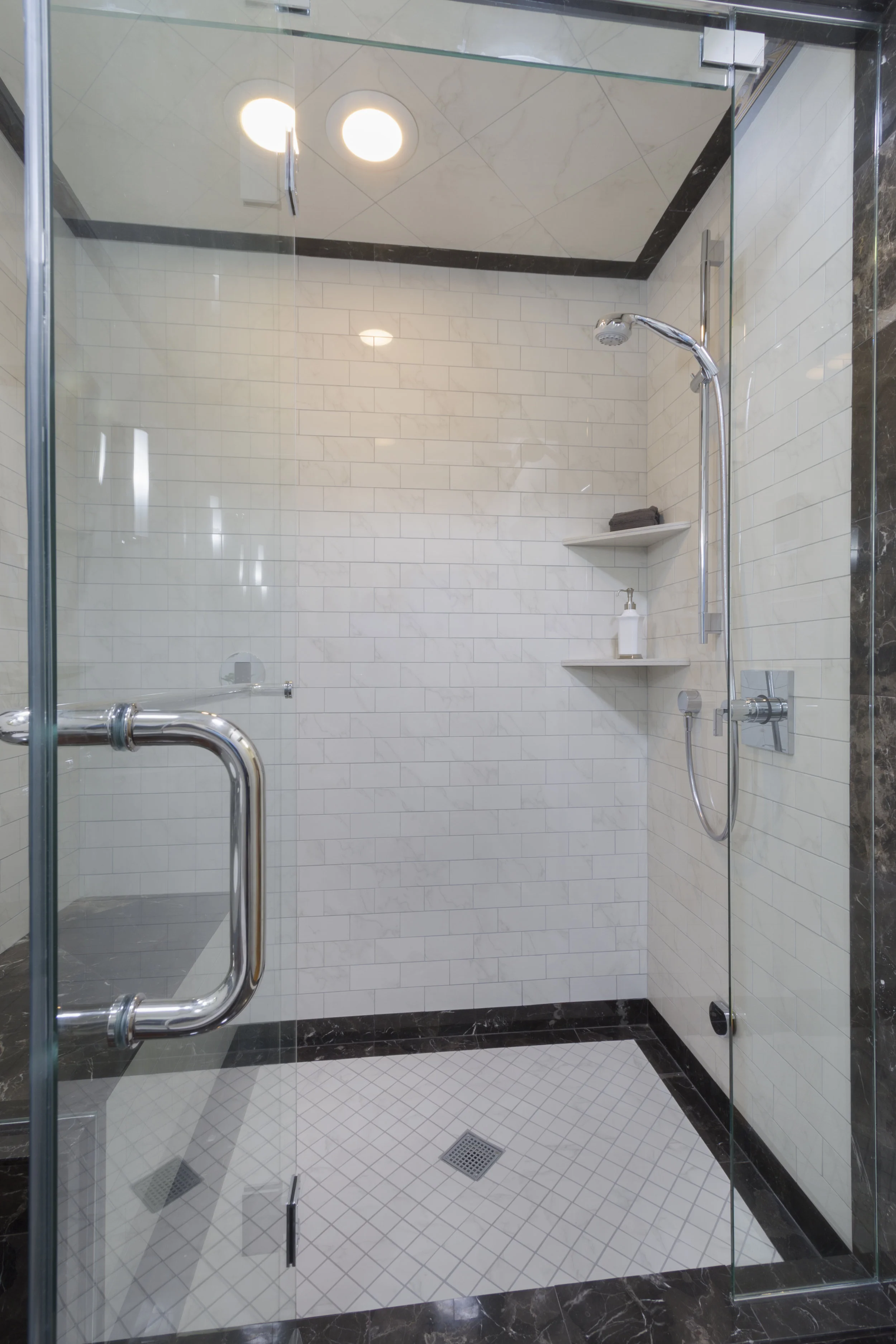In the Master Bathroom, the tile pattern continues into the glass enclosed steam shower.