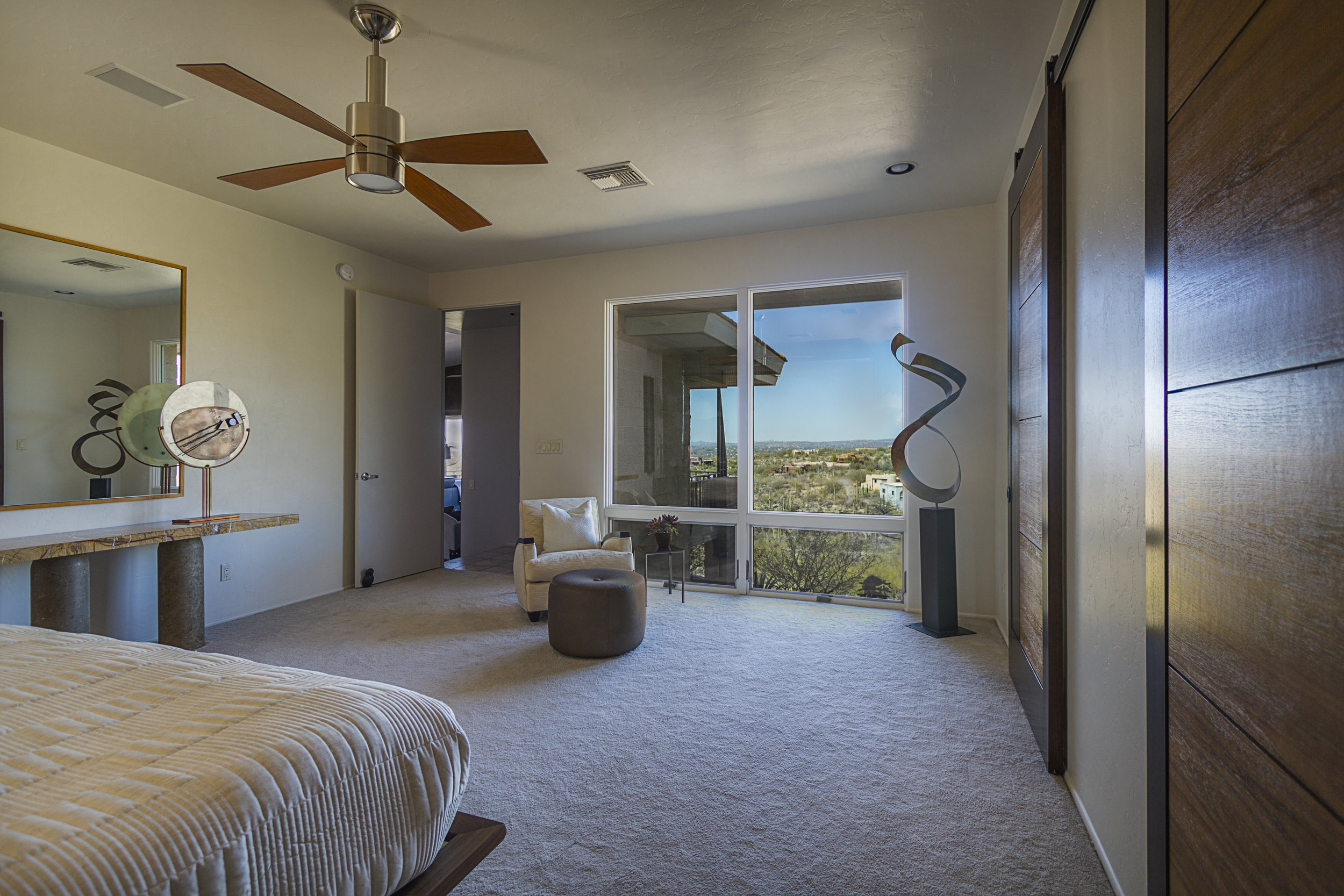  The new windows more than double the amount of glass and view, filling  the Master Bedroom with natural light and views of the desert landscape  and the mountains beyond.   