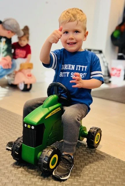 SaraHollandSports LittleKid on Tractor.jpg