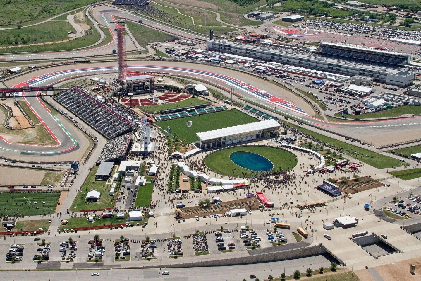 Bordered by the track on three sides, the Grand Plaza at the heart of #CircuitofTheAmericas is ideally situated to capture the energy and atmosphere of the race. #MiroRiveraArchitects #MRAProjectoftheWeek 🔨 @austin_commercial 📷 Dorna Sports