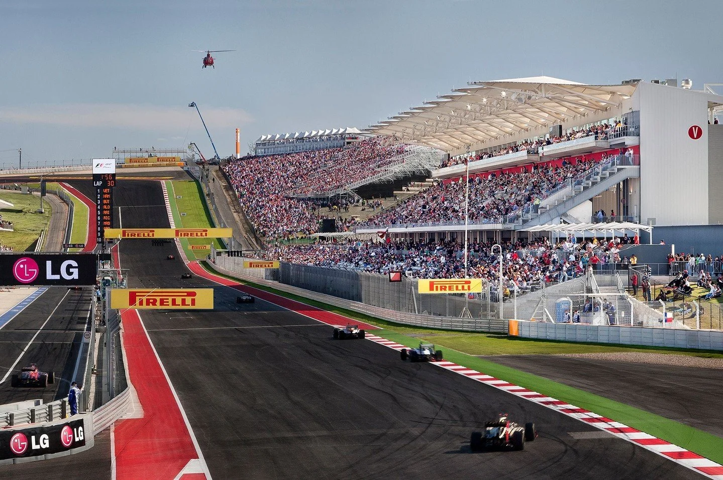 Situated in front of the start and finish lines with views of the track&rsquo;s signature Turn 1, which sends racers careening around a hairpin curve after charging up a hundred-foot incline, the Main Grandstand provides seating for over nine thousan