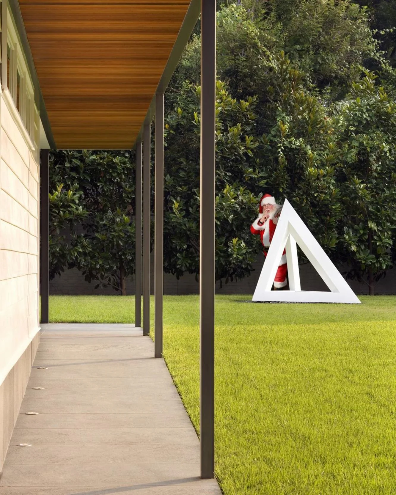 We&rsquo;re taking a look back at some of our office&rsquo;s holiday cards from Christmas past. First up is this shot of Kris Kringle shushing the little ones from behind a Sol LeWitt sculpture at #Residence1414. #MiroRiveraArchitects #happyholidays 