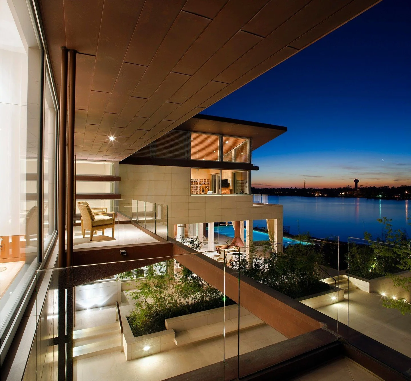 Balconies connected to each bedroom overlook the lake. #LakeshoreResidence #MiroRiveraArchitects #MRAProjectoftheWeek 🔨 Windham Builders 📷 Paul Finkel