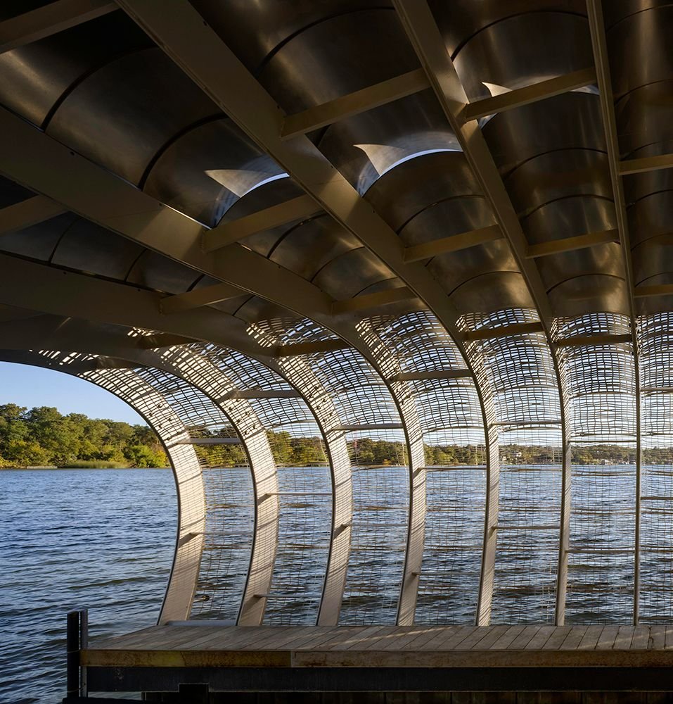 Four variations of openness (67%, 48%, 31% and 17%) were created; the panels graduate from 67% near water level to only 17% at an elevation of 12 feet. Eyebrow-shaped gaps between the solid panels overhead allow for natural ventilation. #DiffuseDock 