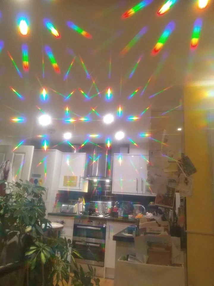 Our kitchen through diffraction glasses - family photo.