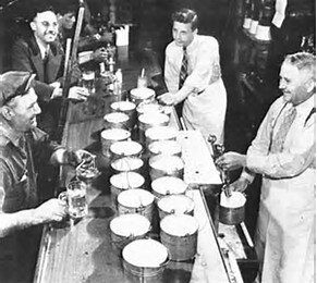 GROWLERS ON BAR WITH MEN.jpeg