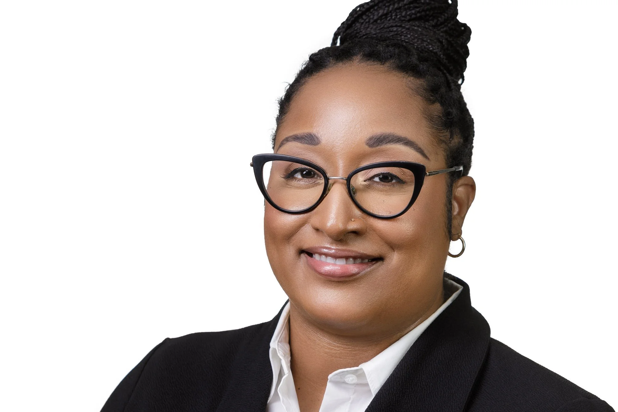 Woman with glasses smiling in a professional portrait.