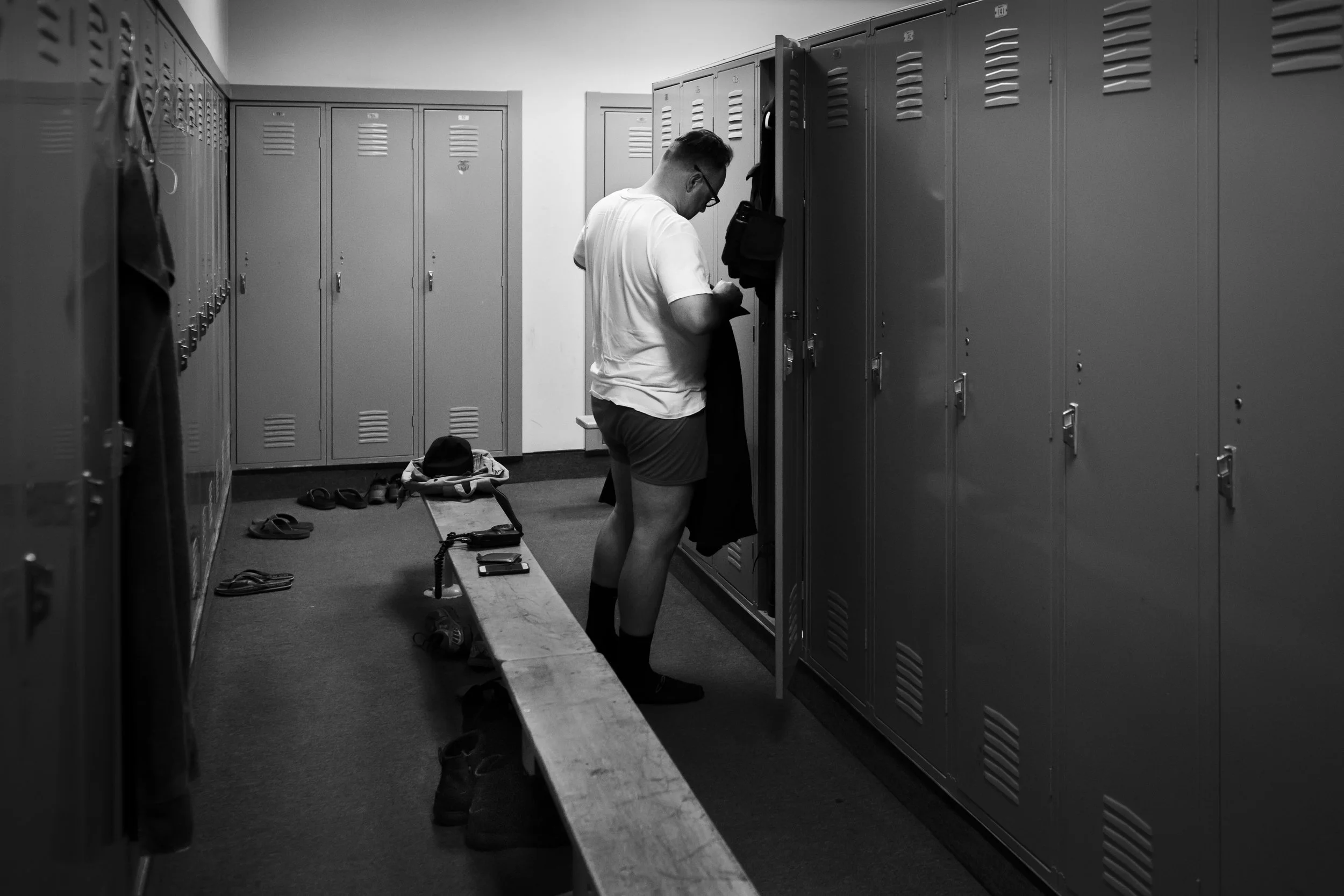 Officer Aguilera changes at his locker in the PSPD locker room.